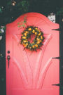 A Wreath with Yellow Flowers on a Pink Door Journal: 150 Page Lined Notebook/Diary