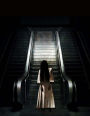 The Ghost on the Escalator Journal: 150 page lined notebook/diary 8.5 X 11 inches