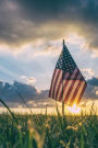 A Sunlit American Flag in a Field United States Journal: 150 Page Lined Notebook/Diary