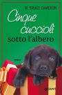 Cinque cuccioli sotto l'albero