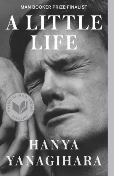 Book Cover of A Little Life by Hanya Yanagirhara. The cover has a black and white photograph of a man with a pained look on his face.