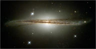 Title: Hubble Photographs Warped Galaxy as Camera Passes Milestone, Author: JH P
