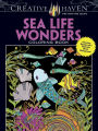 Creative Haven Sea Life Wonders Coloring Book: Amazing Designs on a Dramatic Black Background